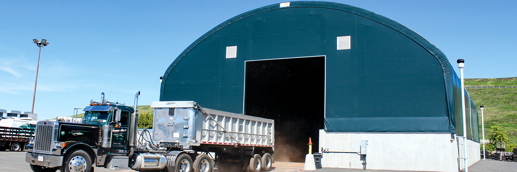 Green Sand and Salt Storage Building with Dump Truck