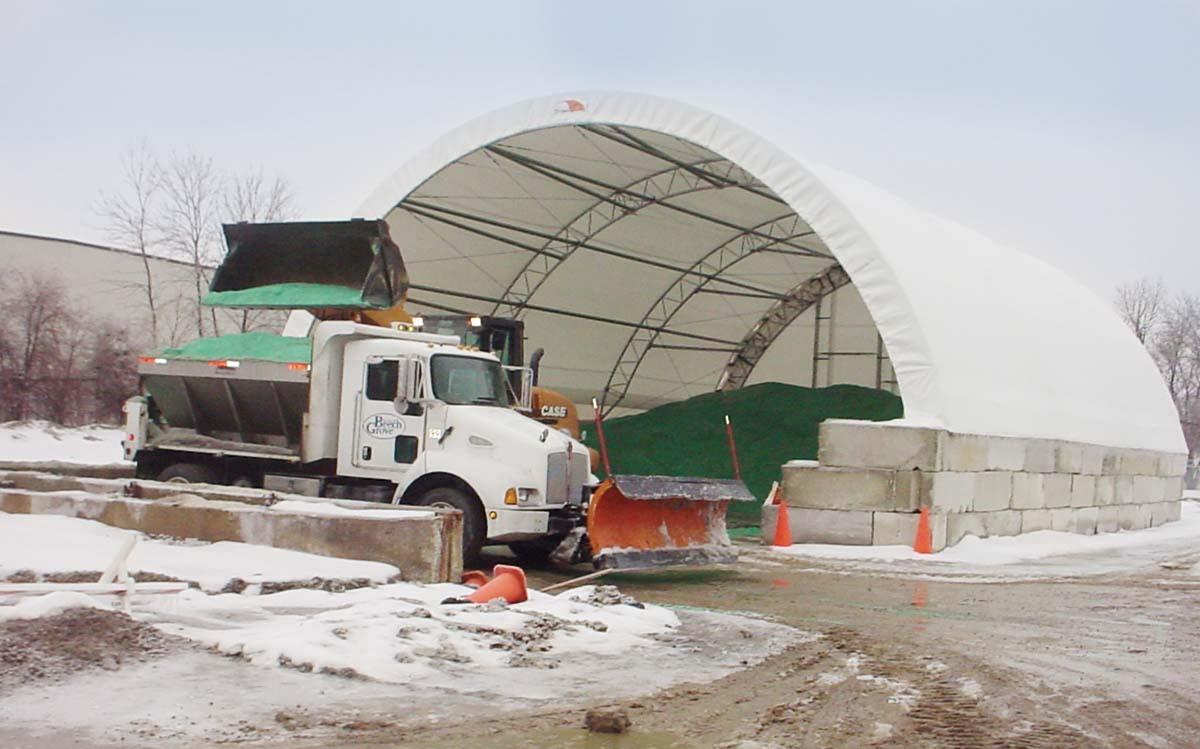 Sand and salt storage with dump truck and dozer