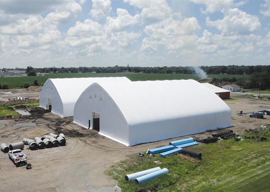 Two white fabric structures with shutters