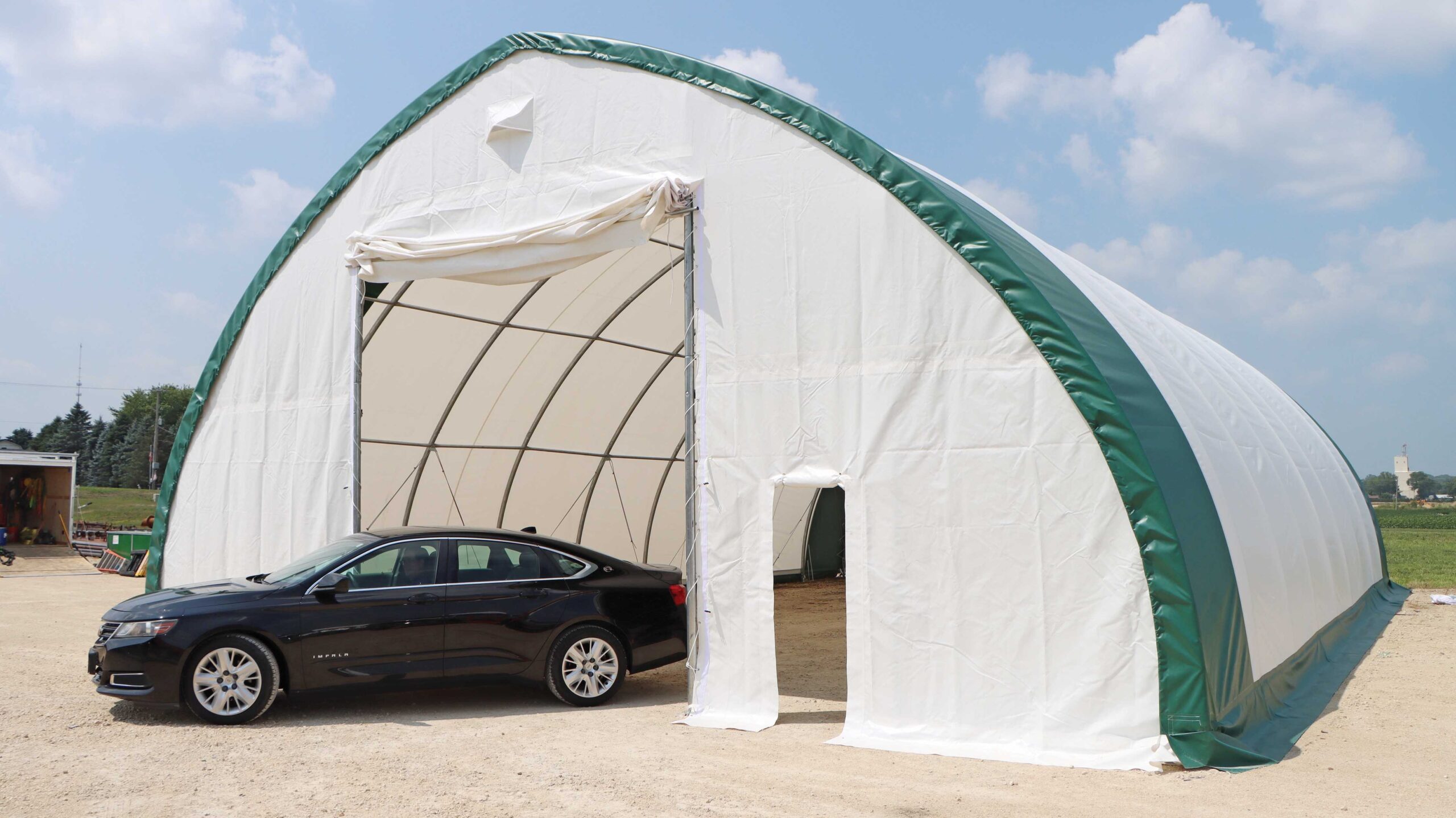 Econoline carport with vehicle in entryway