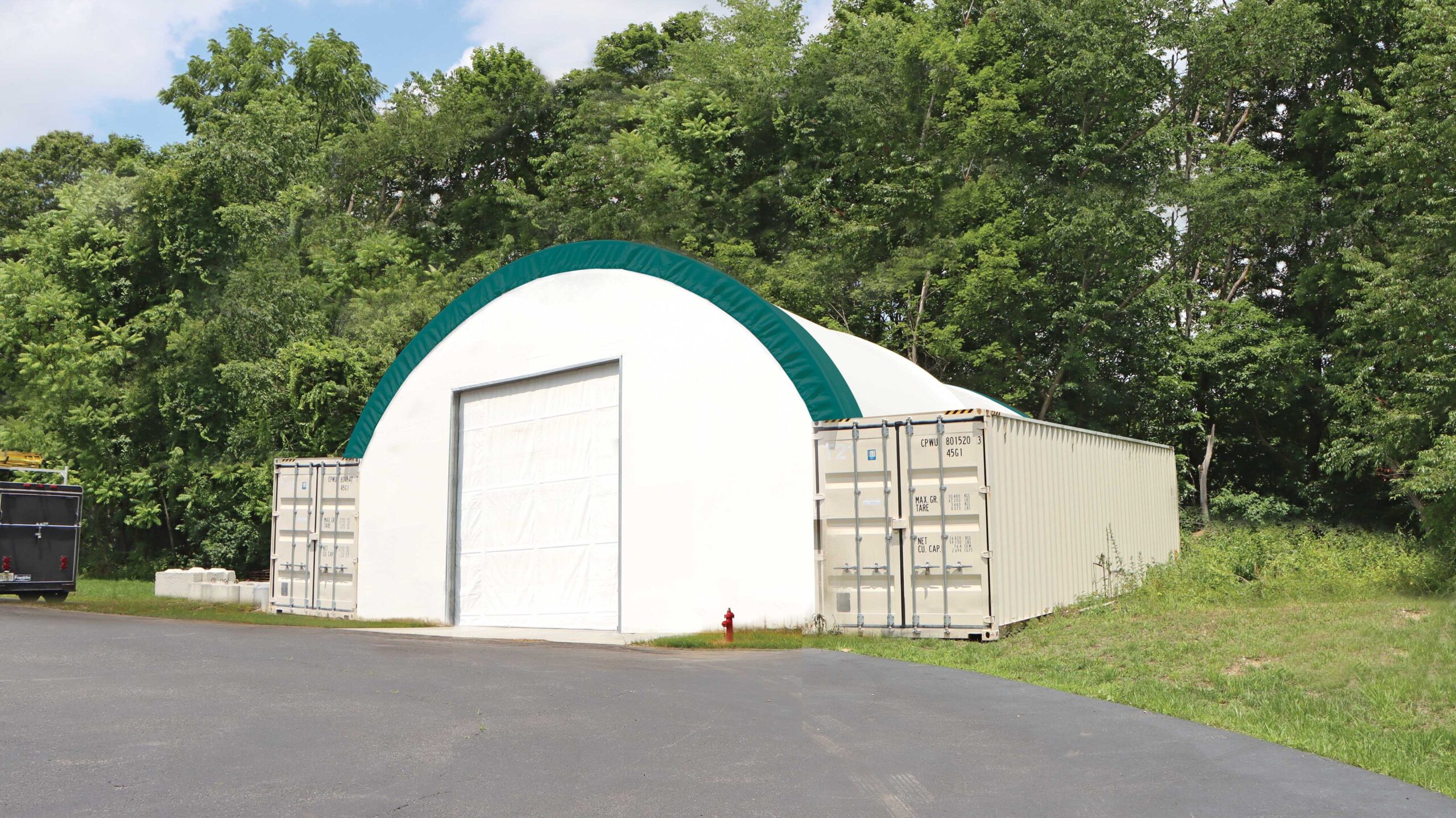 fabric shed mounted on storage containers