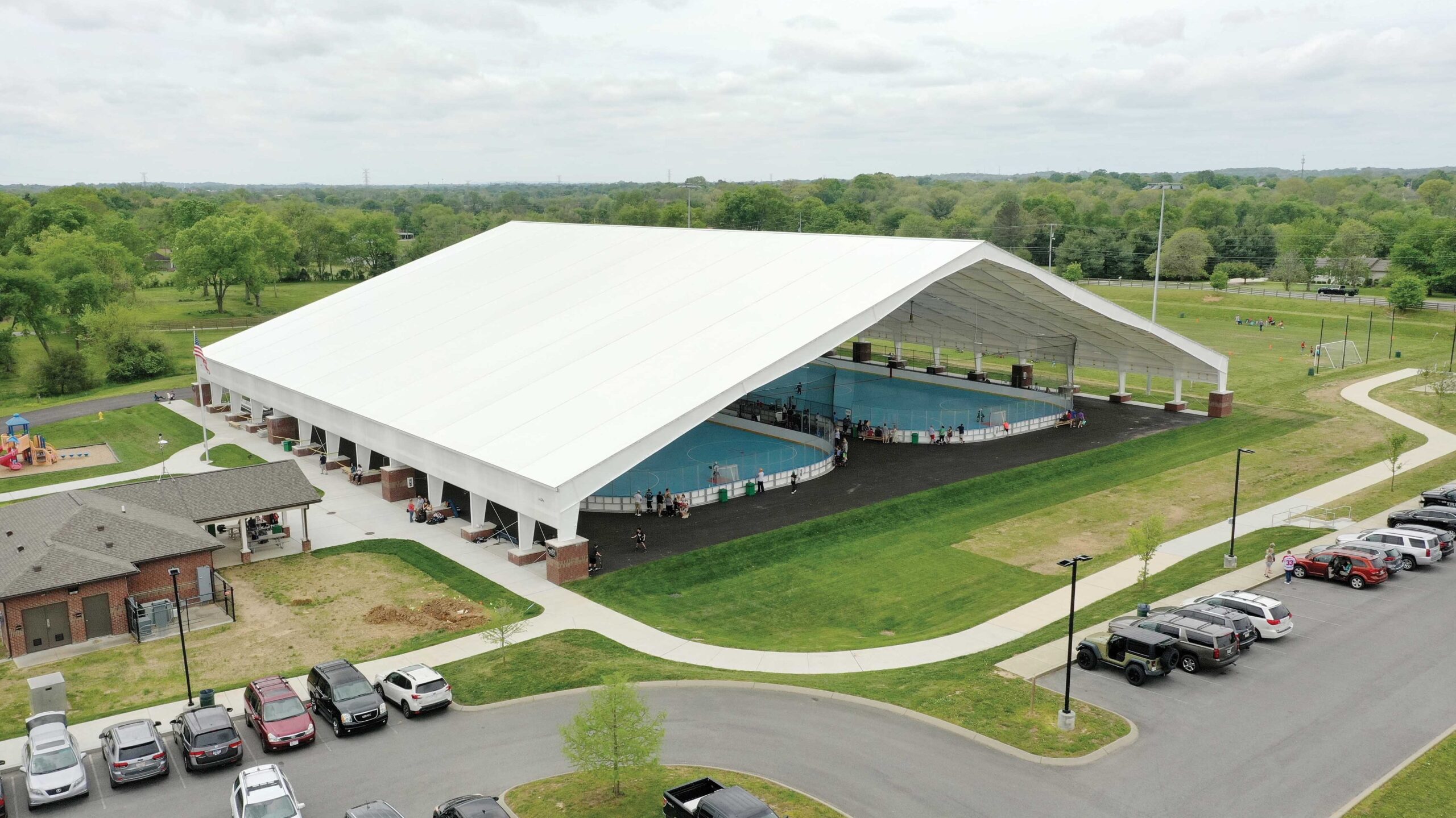 Two inline hockey rinks covered by fabric beam pavilion building