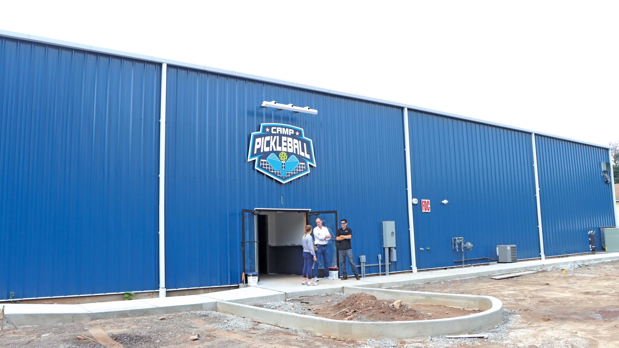 Blue metal recreational building used for pickleball