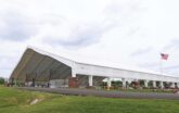 Recreational Building with bricks around beams housing inline hockey arenas