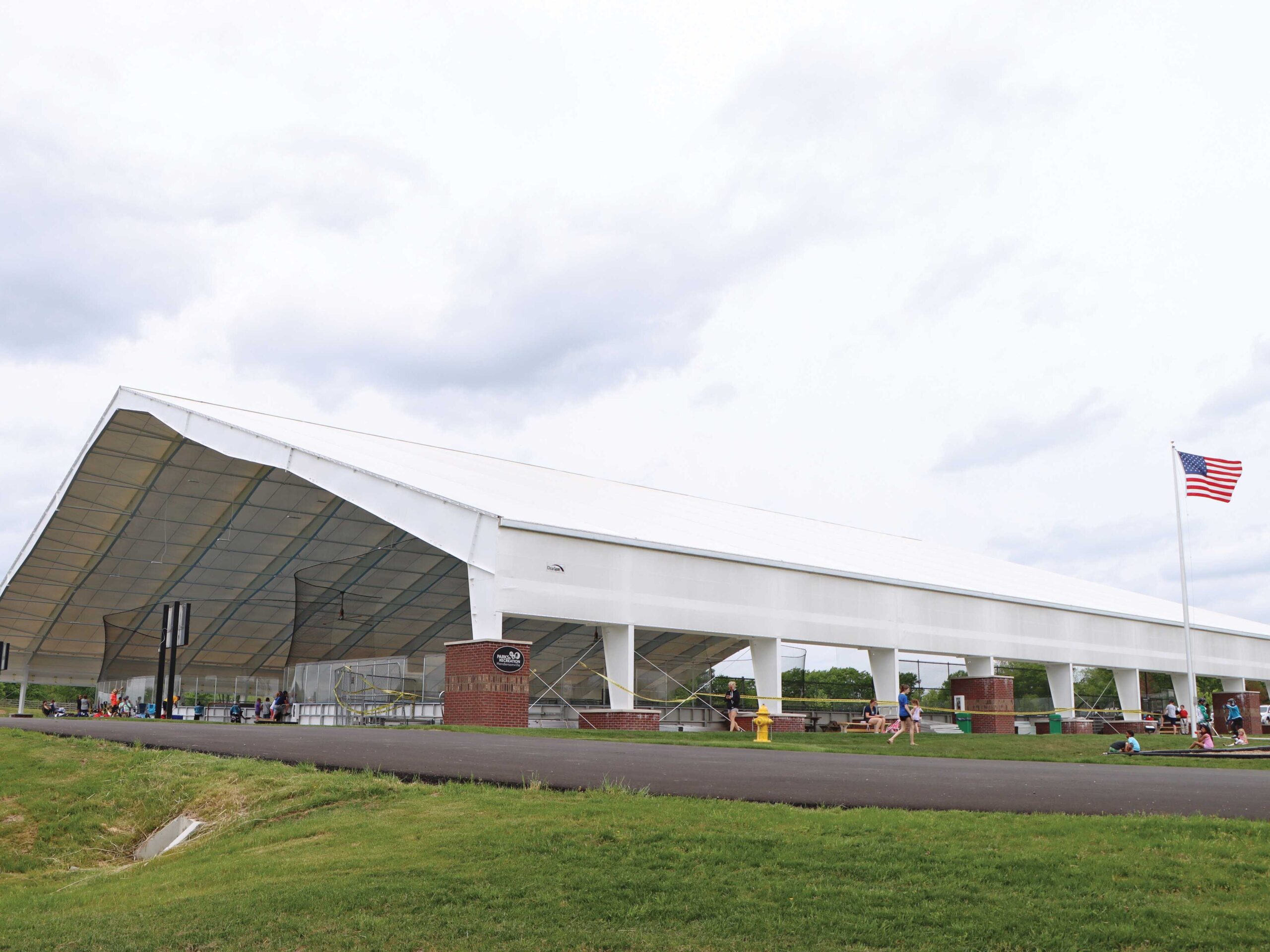 Recreational Building with bricks around beams housing inline hockey arenas