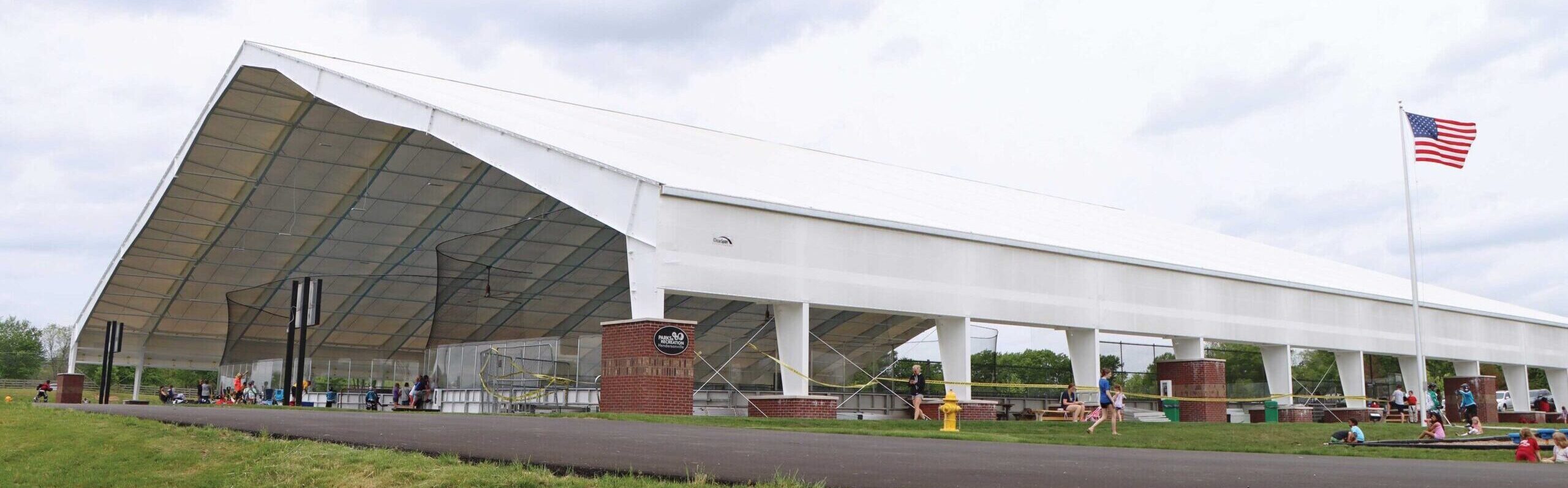 Recreational Building with bricks around beams housing inline hockey arenas