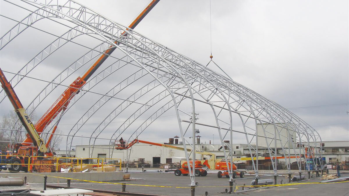 truss building being installed with crane